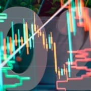 Charts of financial instruments with various type of indicators including volume analysis for professional technical analysis on the monitor of a computer.