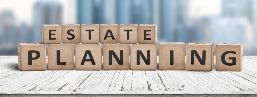 Estate planning sign on a wooden pier with tall buildings in the background