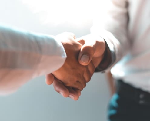 Men and women negotiate to congratulate a successful business ,Shaking hands concept.