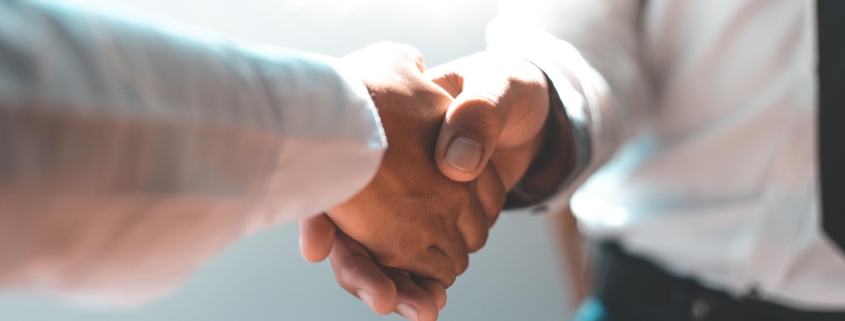 Men and women negotiate to congratulate a successful business ,Shaking hands concept.