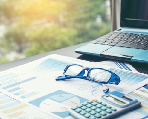 Excel graph with Spreadsheet Document showing Information Financial Startup Concept. Financial Planning making Accounting Database Report. Graphs and chart on screen with stationery set business stuff