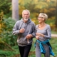 Smiling senior couple jogging in the park