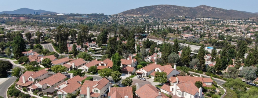 Aerial view of middle class neighborhood with residential house community and mountain on the background in Rancho Bernardo, South California, USA.