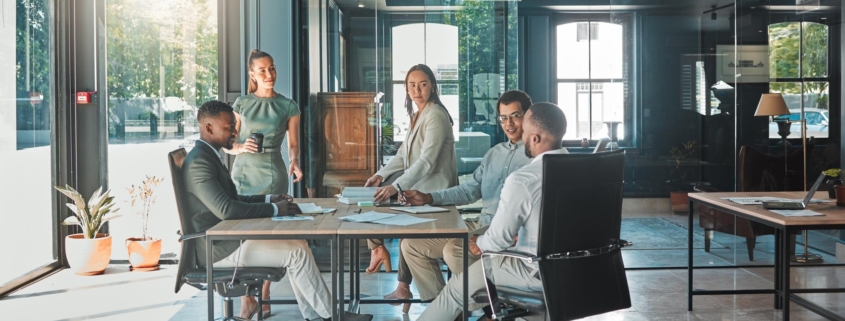 Corporate business meeting, team collaboration and strategy planning in a startup company. Office workers, diversity employees and workforce having discussion, brainstorm and speaking in an agency