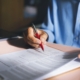 Close-up view on desk office, businessman signing a contract of investment or insurance, legal agreement on the table, Starting successful partnership with entrepreneur or companie, making good deal