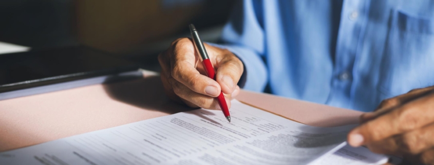 Close-up view on desk office, businessman signing a contract of investment or insurance, legal agreement on the table, Starting successful partnership with entrepreneur or companie, making good deal