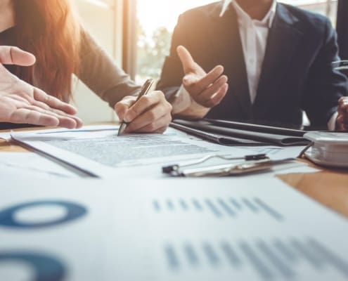Business Signing a Contract Buy - sell house.