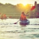 Kayaking and canoeing with family. Children on canoe. Family on kayak ride.