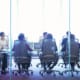 Exit negotiations in a board room through a plate glass window